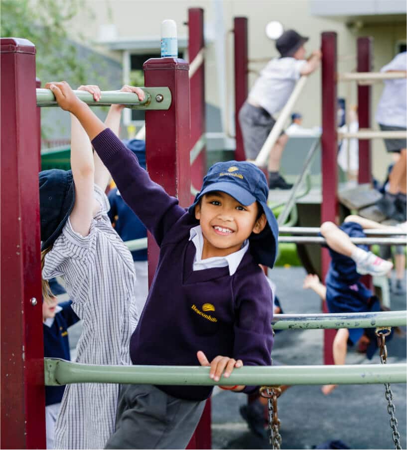 Student with hat in playground