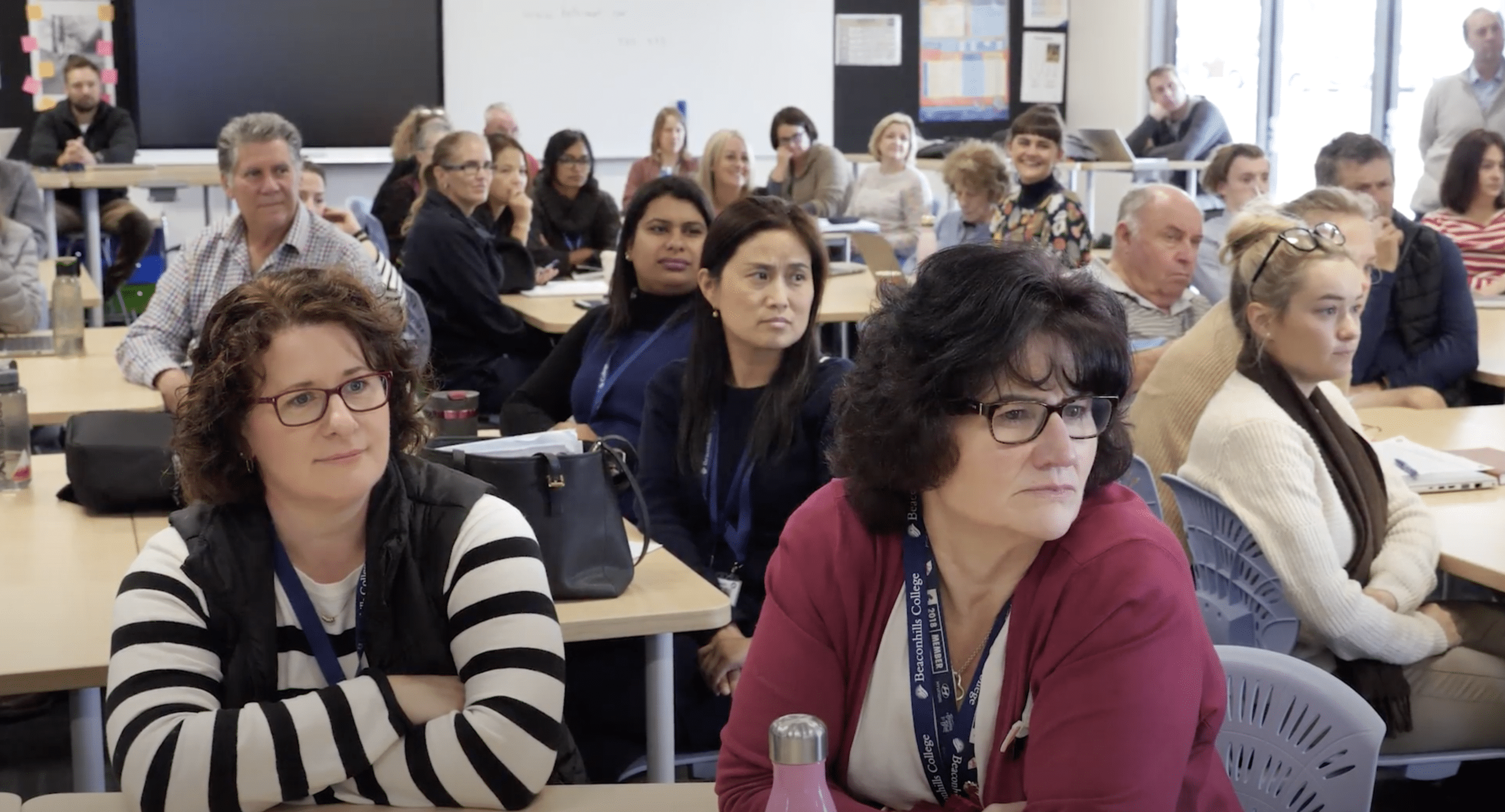 A group of teachers in a professional development workshop
