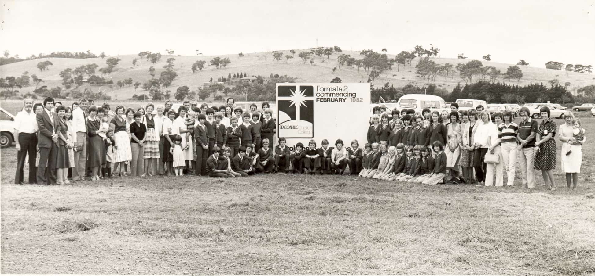Group of staff and students outside on school opening day 1982