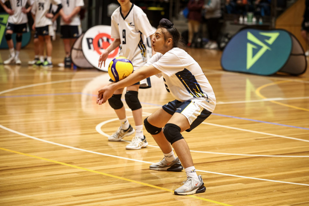 Naveen Sekhon playing volleyball.