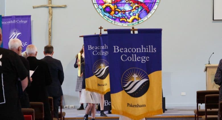 Students-carrying-flags-at-assembly