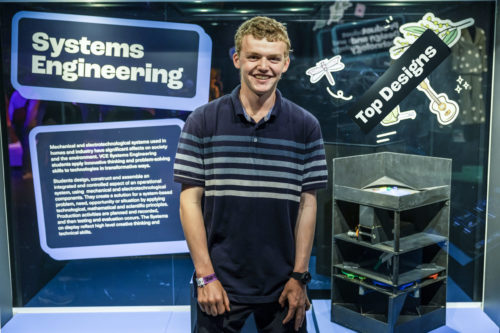 Student with his winning Top Design