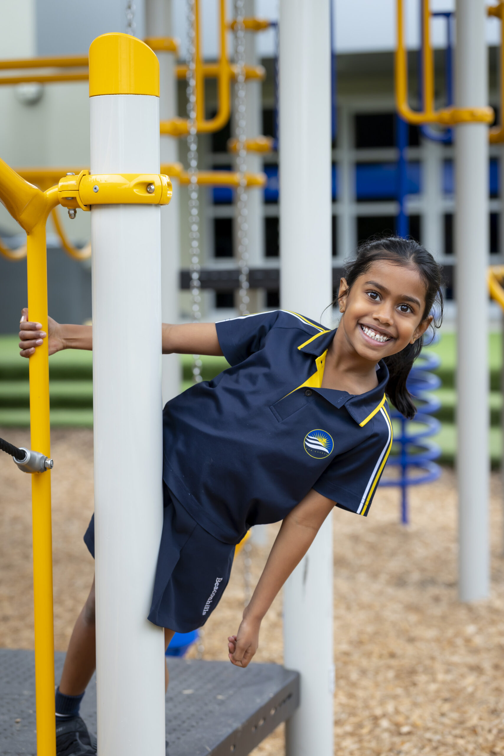 Girl smiling in playground.