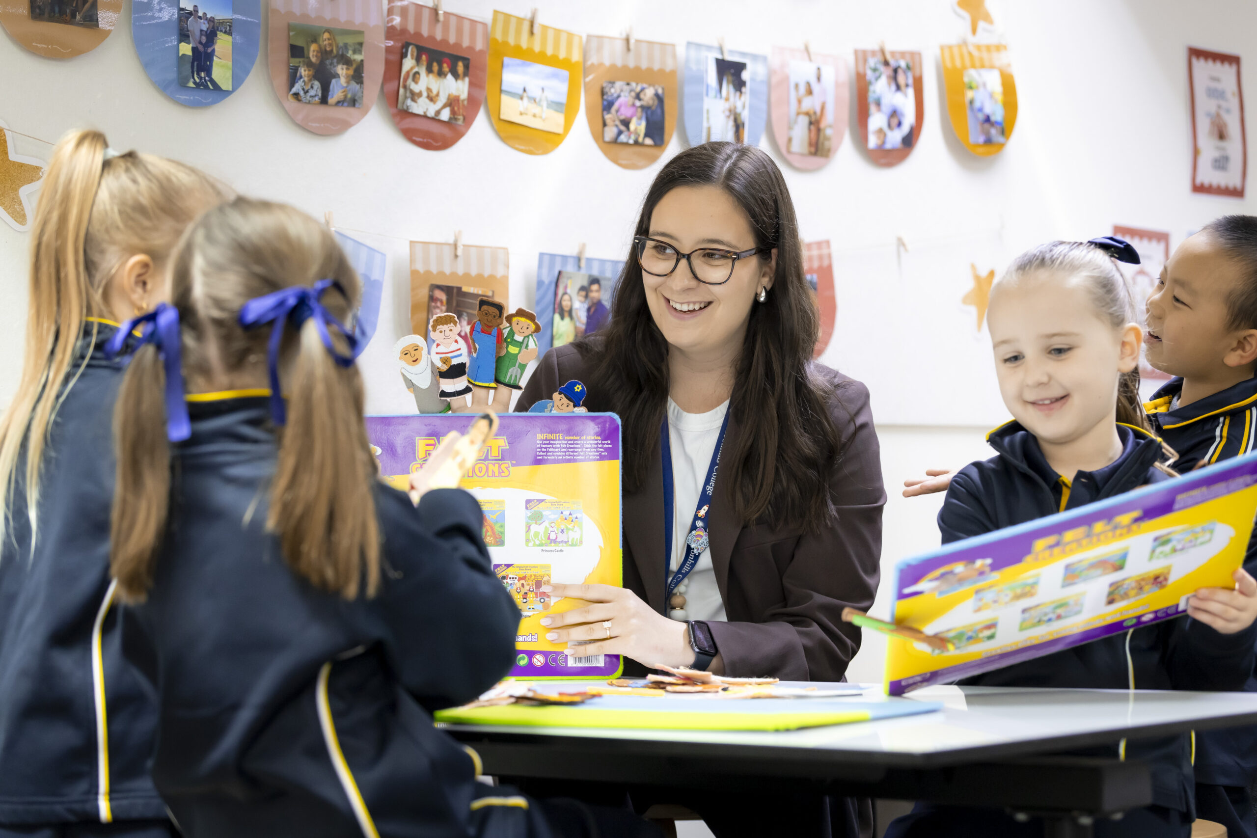 Teacher helping students with work.