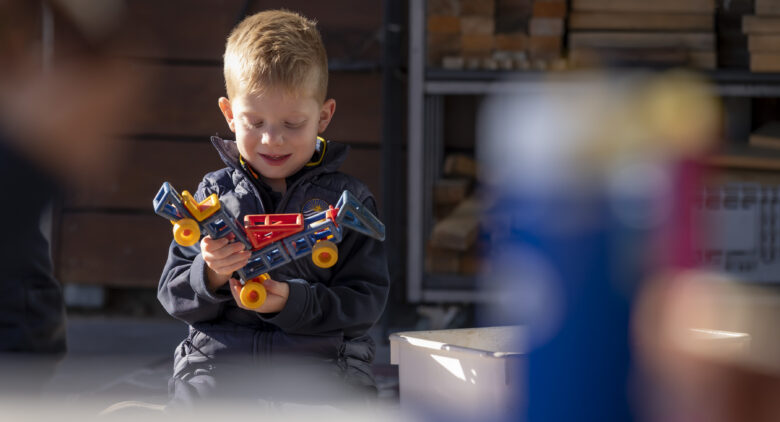 Boy_playing_with_toy_BHC